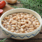 cooked navy beans in a bowl