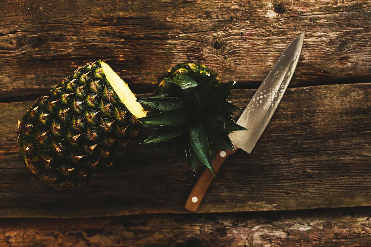 peeling and cutting pineapple